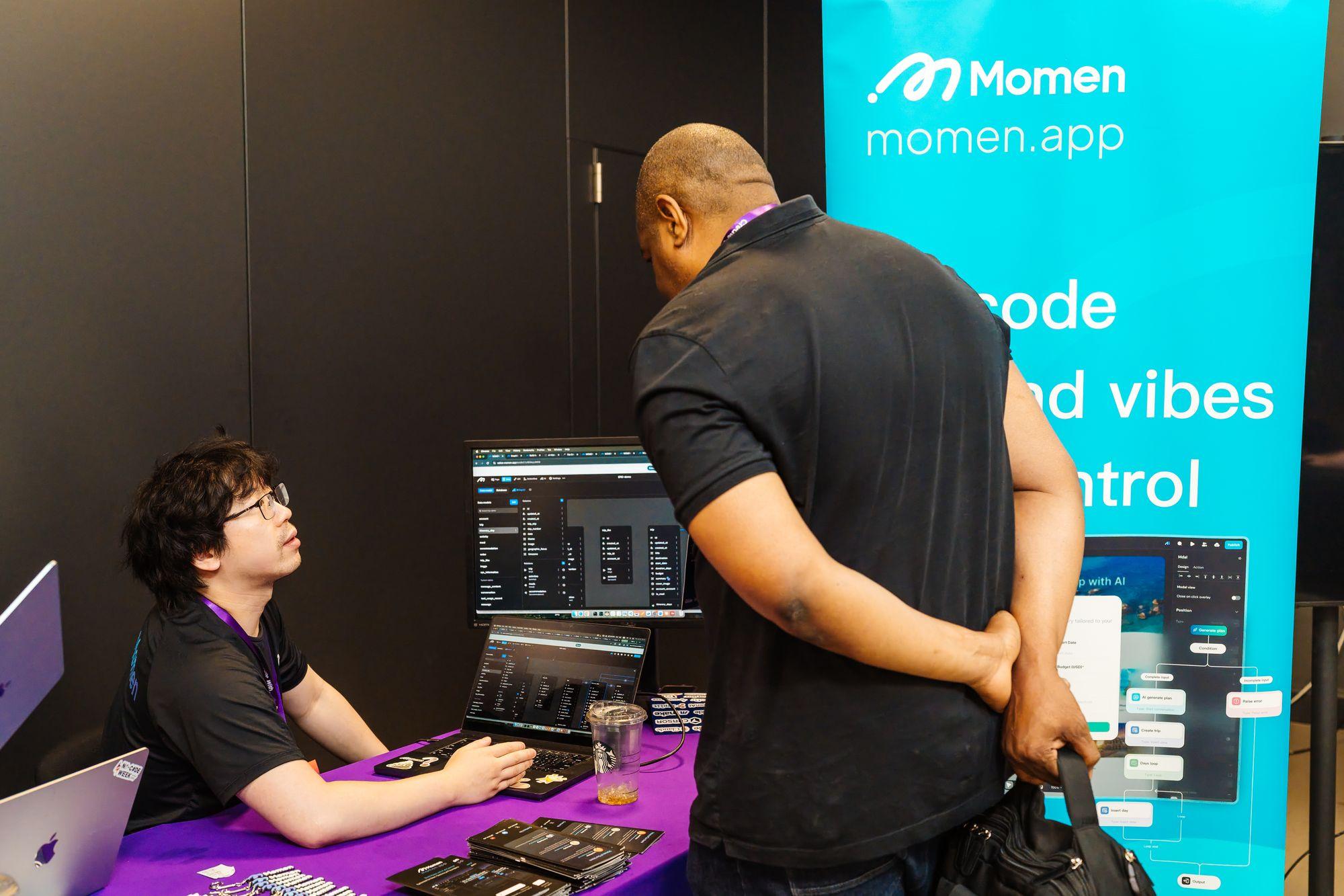An attendee watching a demo at the Momen stand