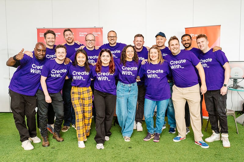 Create With team in purple t-shirts